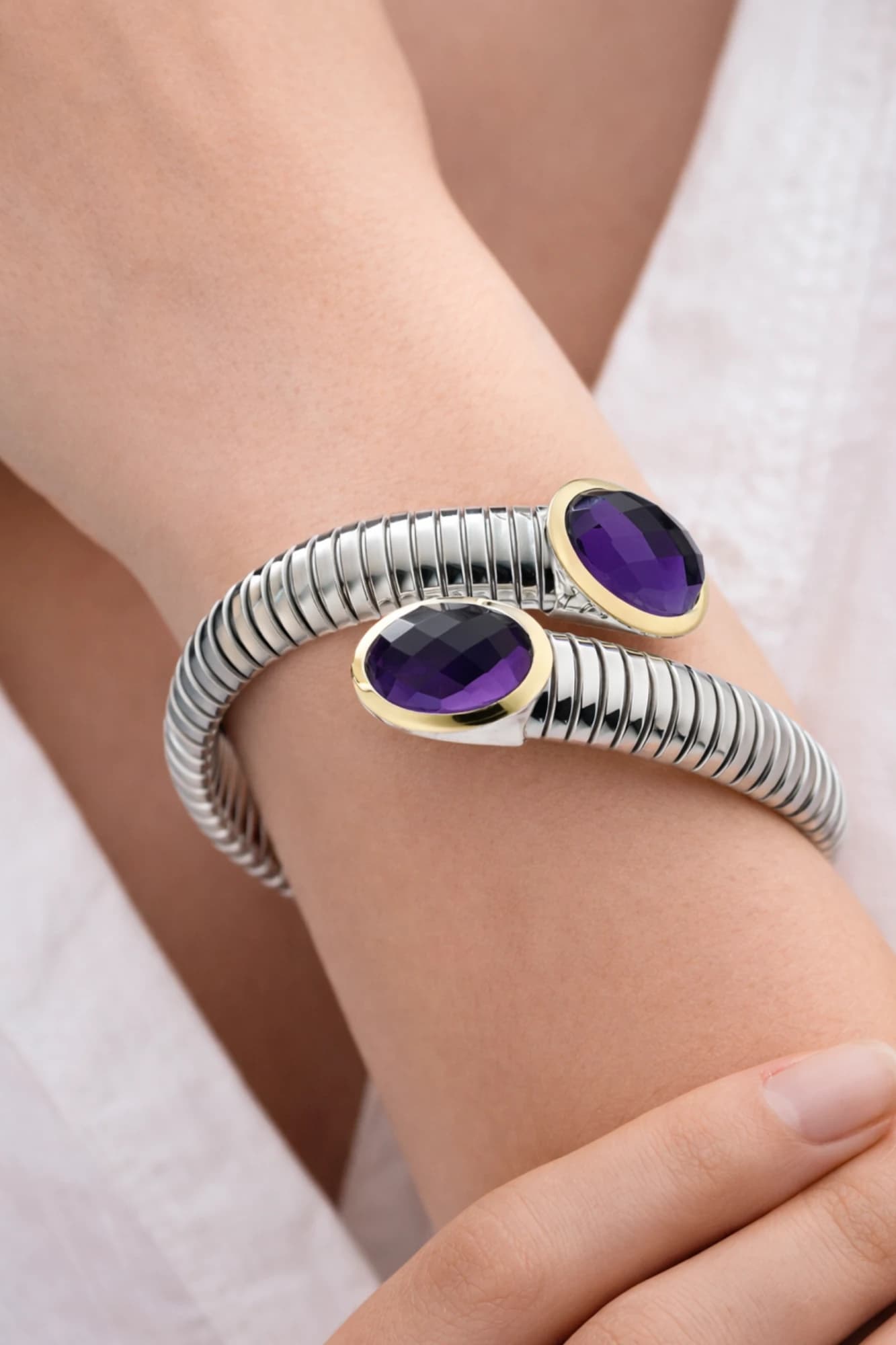 RUDY tubogas bracelet with purple stones worn on the wrist